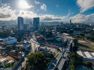 Obraz premium Beautiful aerial view of Tegucigalpa, capital of Honduras, surrounded by mountains and the city glowing across the urban valley