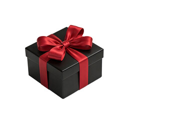 Fototapeta premium Black square gift box with glossy finish and a large red satin ribbon bow, suitable for festive occasions like holidays, birthdays, or celebrations. Isolated on white background.