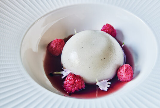 panna cotta dessert with fresh raspberries 