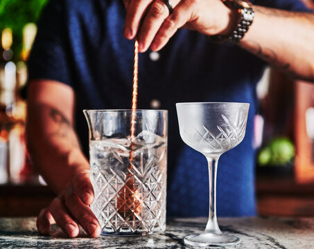 Bartender stiring a vodka cocktail