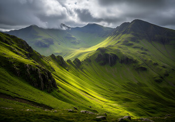 Steep green country side landscape over cloudy sky