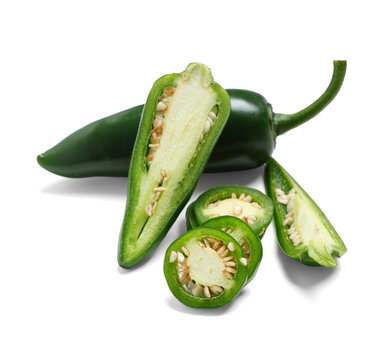 Composition with whole and cut jalapeno peppers isolated on white background