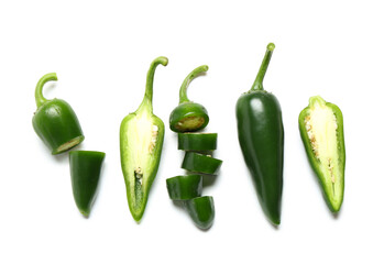 Obraz premium Composition with cut green jalapeno peppers on white background
