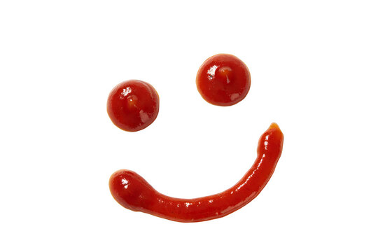A creative smiley face made with red ketchup on a white background, representing fun and appetizing food presentation through artistic condiment composition.