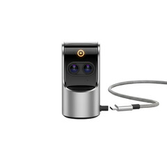 Silver and black camera with dual lenses and U S B cable on black background USB cable