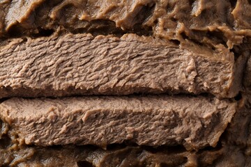 Textured close up of layered brown German sauerbraten meat