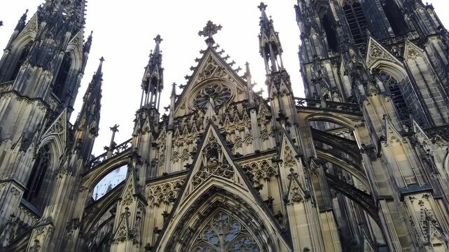 Detailed view of a Gothic cathedral facade with intricate carvings and tall spires