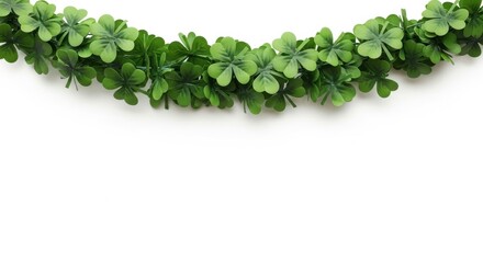 Vibrant Green Shamrock Garland Adorns White Background for St Patricks Day Celebration.