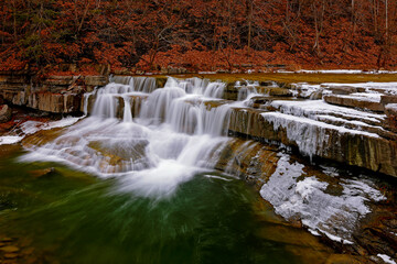 waterfall in autumn forest © Inna