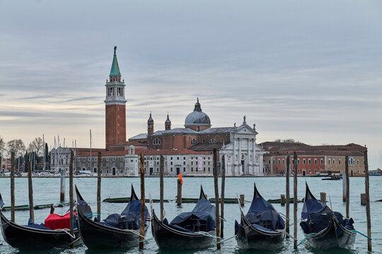 San Giorgio Maggiore church and bell tower seen from Venice with gondolas, Italy