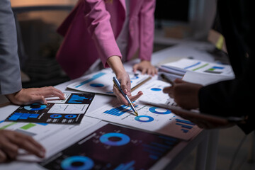 Fototapeta premium Business people analysing data charts during meeting