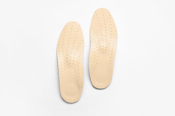 Fototapeta premium Leather orthopedic insoles isolated on white background