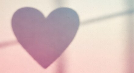 A heart-shaped object is prominently displayed against a softly blurred background