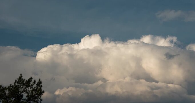 Timelapse of thick wall of clouds rolling in the afternoon sky