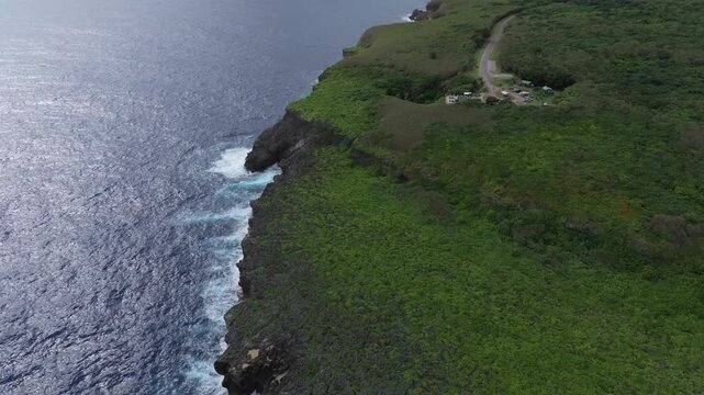 Discover the mesmerizing 'Grotto Blue.' This aerial footage captures The Grotto in Northern Saipan, a world-renowned collapsed limestone cavern and a premier destination for scuba divers. The video sh