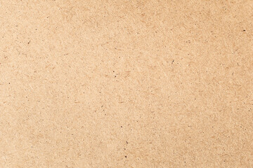Fototapeta premium Brown paper background close-up with copy space