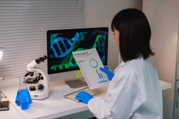 Scientist analyzing genetic data and research lab results