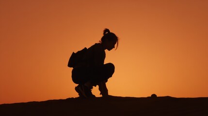 Silhouette of a person with the setting sun creating a dramatic and serene scene