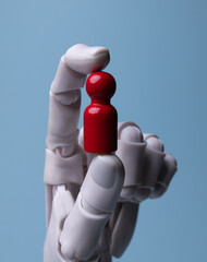 AI Robotic Hand Holding Red Figure for Leadership and Talent Selection