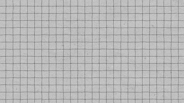 A high angle shot of textured grid paper surface ready for notes and calculations.