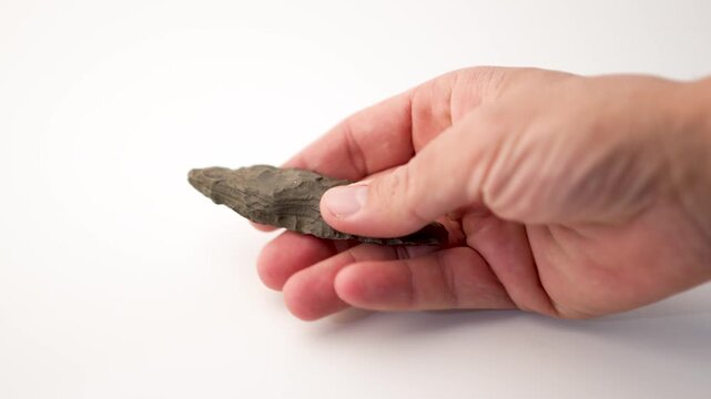 Paleolithic Bifacial Spearhead Stone Tool Isolated on White Background, 4K Video
