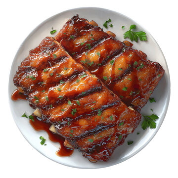 Deliciously glazed and grilled pork spare ribs slathered in sweet barbecue sauce and sprinkled with fresh parsley served on a white plate viewed from above