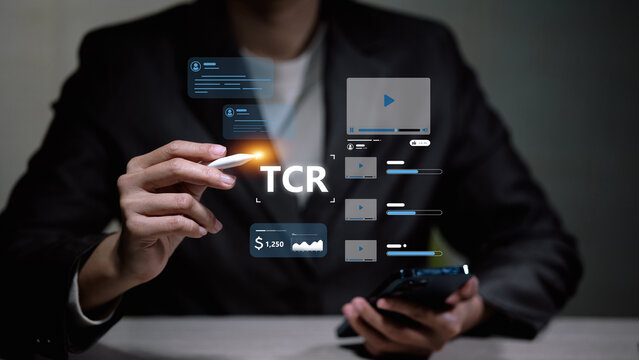 Business person analyzing video content performance metrics and TCR with virtual social media icons.