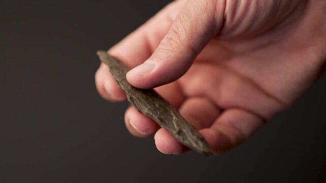 Paleolithic Biface Stone Spearhead: Authentic Prehistoric Artifact and Ancient Hunting Tool (4K video. 50 fps)
