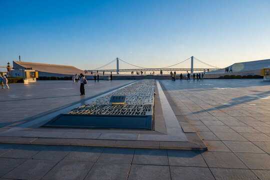 View of Xinghai Bay Bridge from Xinghai Square at Sunset in Dalian, China