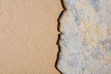 Broken plan fixed plan Peeling Beige Paint on Textured Gray Concrete Surface abstract