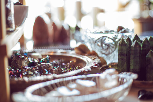 Rainbow crystals and gemstones and crystal towers in bowls in a metaphysical witch home goods shop