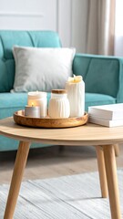 Teal sofa, wooden table with candles, books; cozy home interior