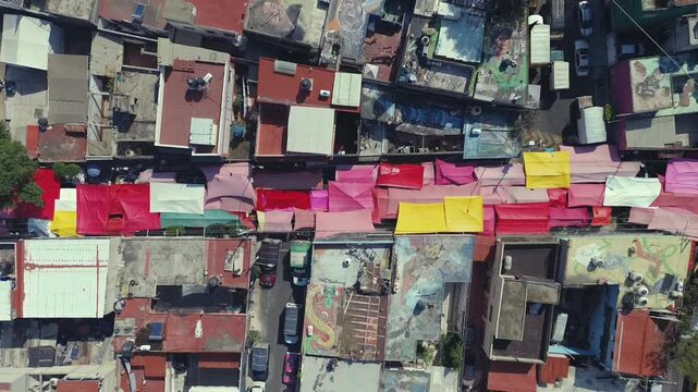 Aerial Drone View of Street Market Tents Over Dense Neighborhood in Iztapalapa, Mexico City