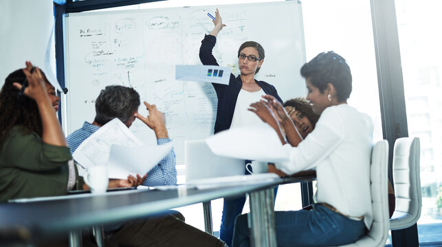 Angry woman, chaos and team with presentation on whiteboard for bad idea, disagreement or mistake. Frustrated, female person or conflict with employees or complaint for project fail or argument