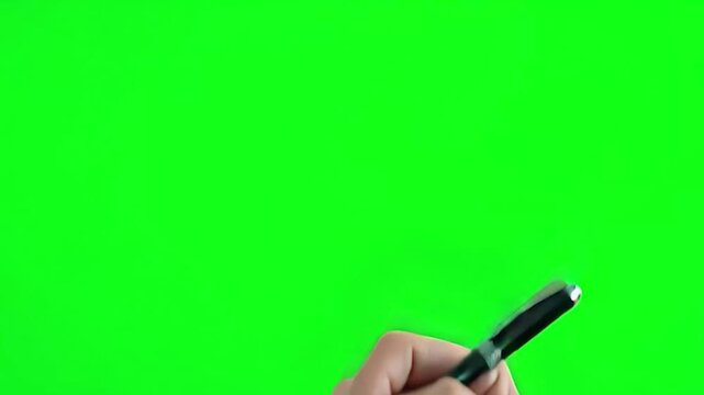 A hand holding a pen and miming a signature in the air, isolated on plain Green screen chroma key