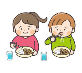 カレーライスを食べる男の子と女の子のイラスト