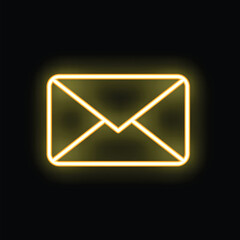 Yellow neon mail envelope is glowing on a black background