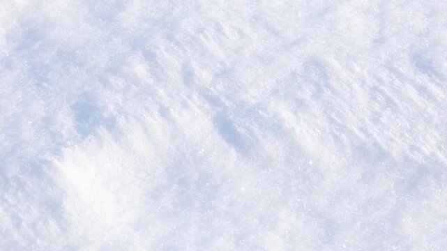 Detailed textured surface of pure white fresh winter snow glistening with many tiny ice crystals