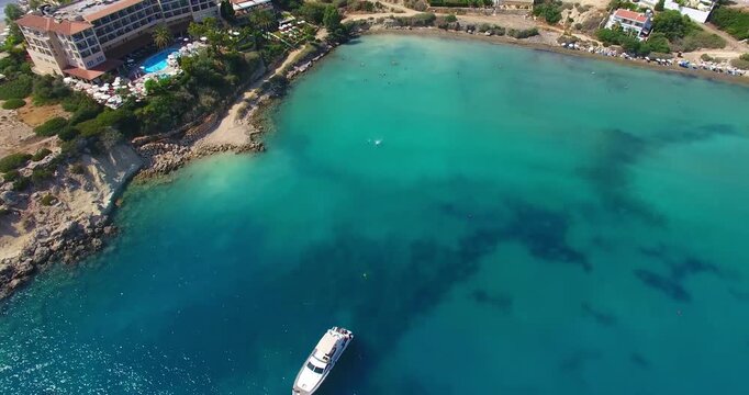 Cyprus, Pafos, 4K Aerial View of Serene Blue Waters and Yacht in Coastal Resort Area