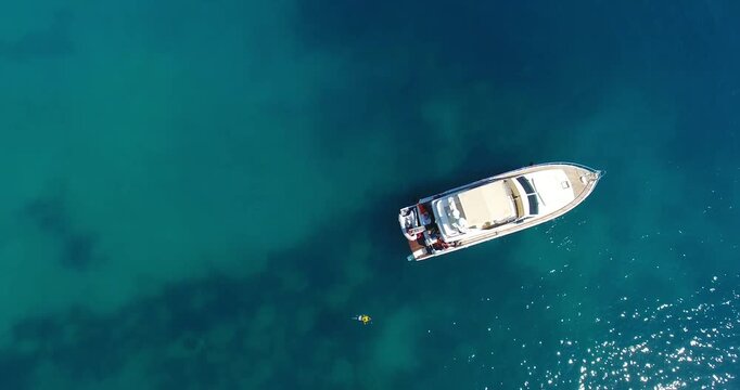 4K aerial video of Cyprus: a luxury yacht on the water in crystal-clear turquoise waters. Perfect for a private charter