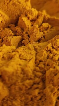 Powdered turmeric placed on a table for cooking and health benefits in various dishes