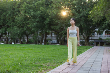 Woman walking in park for fitness