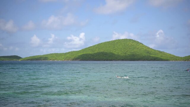 Snorkeler swims in clear waters off Tamarindo Beach, Puerto Rico