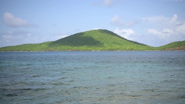 Green hills and calm ocean at Tamarindo Beach, Puerto Rico