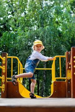 A little boy at a playground. Happy childhood.