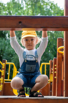 A little boy at a playground. Happy childhood.