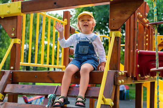 A little boy at a playground. Happy childhood.