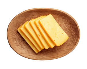 Yellow cheese slices stacked in light brown, oval wooden bowl on dark background