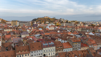 Aerial drone view on streets and city of Brasov,  beautiful houses, Transylvania, Romania. Beautiful famous must-see tourist attraction. Travel destination. Hills, mountains in background. © Dirk