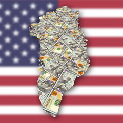 Financial and economic illustration. Map of Greenland and many 100 dollars US bills. Blurred flag of United States of America